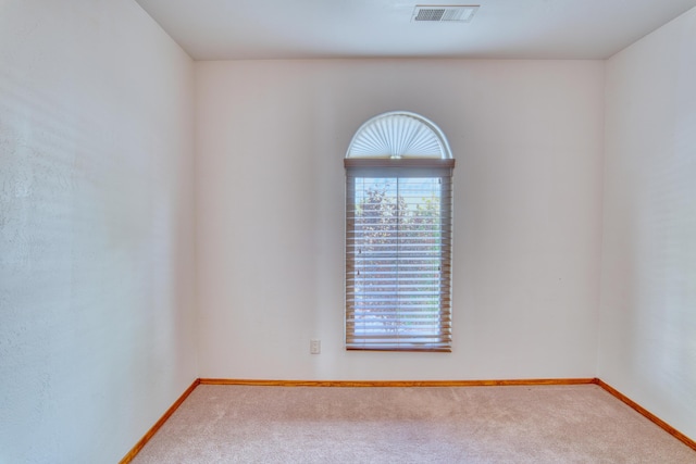 unfurnished room with carpet flooring