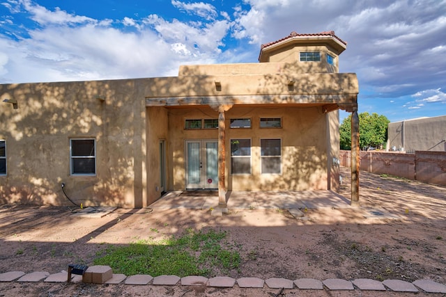 back of house with a patio