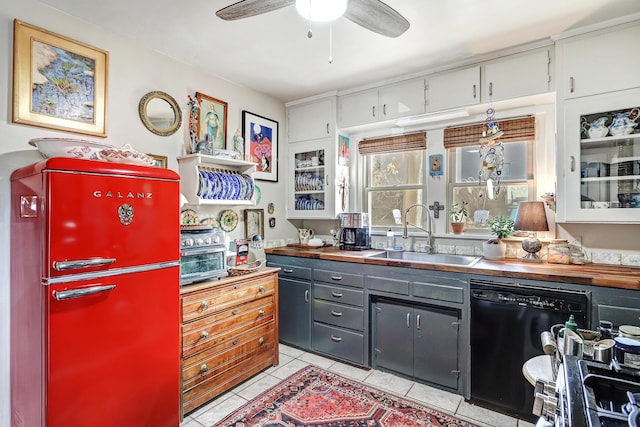 kitchen featuring dishwasher, white cabinetry, sink, and fridge