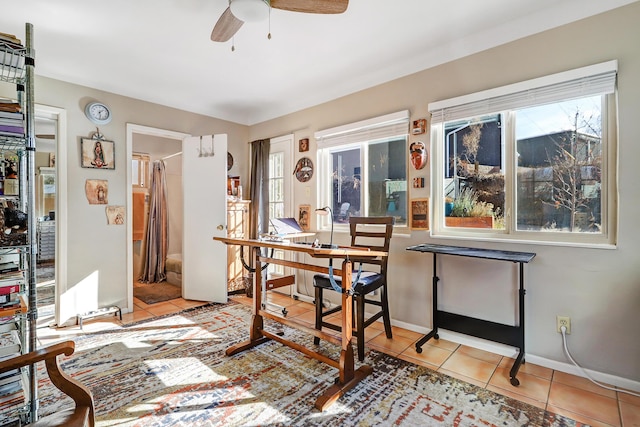 office space featuring ceiling fan and light tile patterned floors