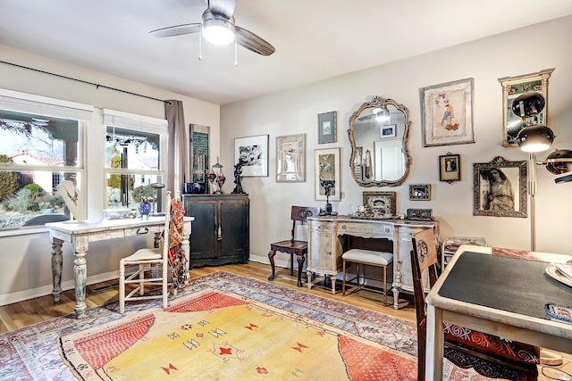 office space featuring wood-type flooring and ceiling fan