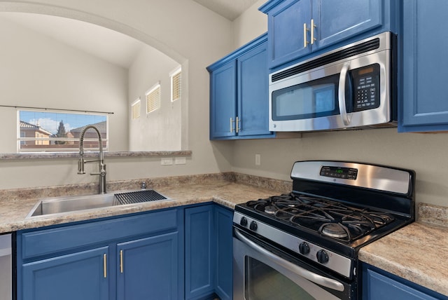 kitchen featuring blue cabinetry, sink, and stainless steel appliances