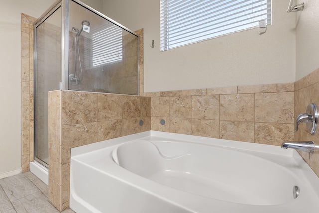 bathroom with a wealth of natural light and plus walk in shower