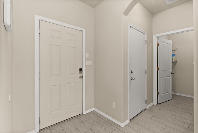 entryway featuring a textured ceiling