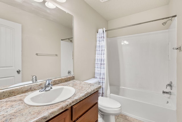 full bathroom with shower / bath combo, vanity, a textured ceiling, tile patterned flooring, and toilet