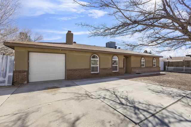 single story home with a garage