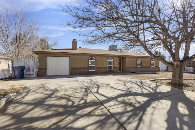 ranch-style house featuring a garage