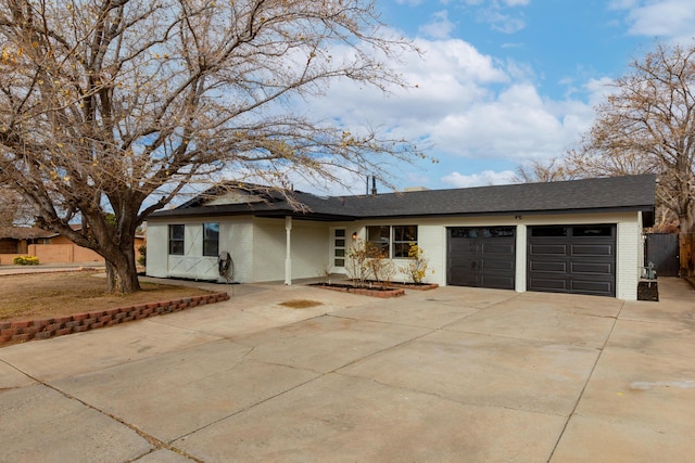 single story home featuring a garage