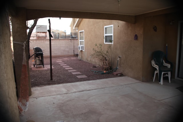 view of patio featuring area for grilling and cooling unit