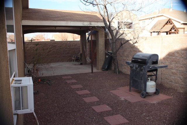 view of patio with area for grilling and a gazebo