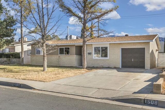 single story home featuring a garage