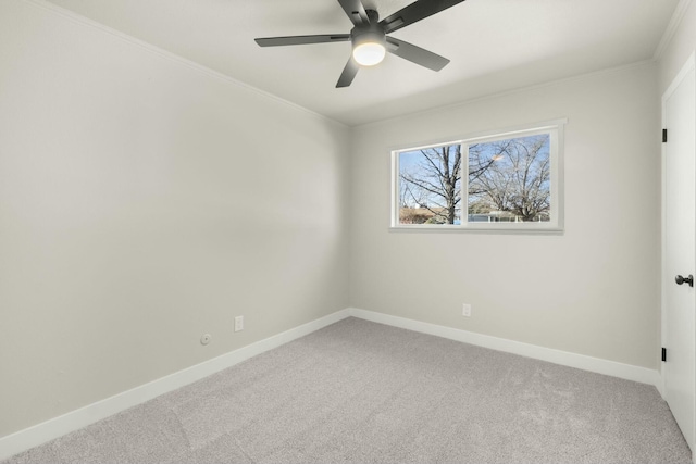 empty room featuring ornamental molding, ceiling fan, and carpet flooring