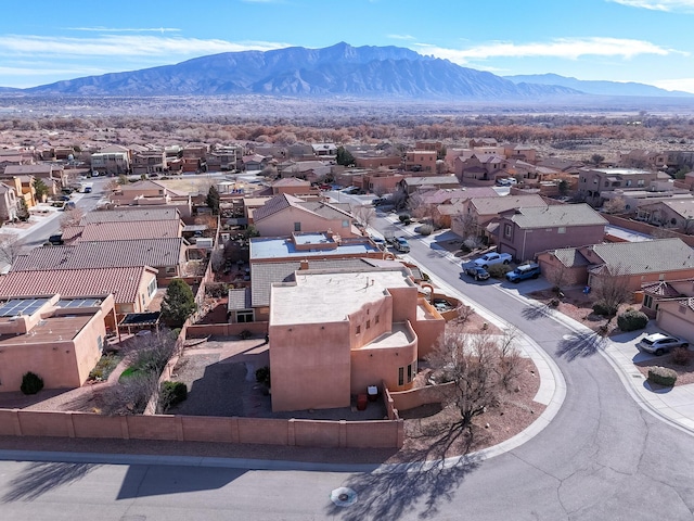 birds eye view of property with a mountain view