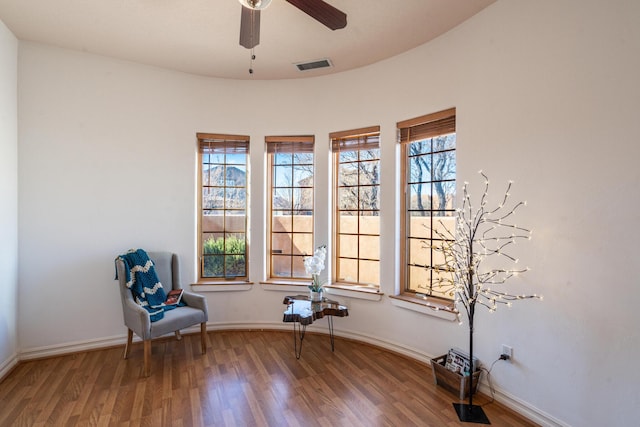 unfurnished room with ceiling fan and wood-type flooring