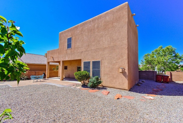 view of front of home featuring a patio