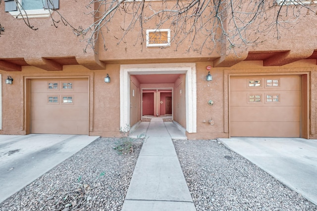 view of exterior entry featuring a garage