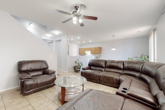 living room featuring light tile patterned flooring and ceiling fan