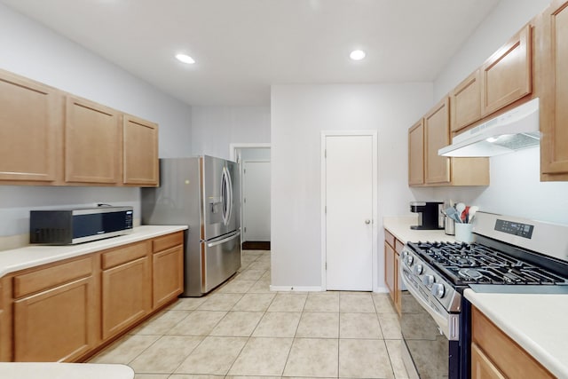 kitchen featuring light tile patterned floors, light brown cabinets, and appliances with stainless steel finishes