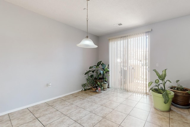 spare room with light tile patterned floors