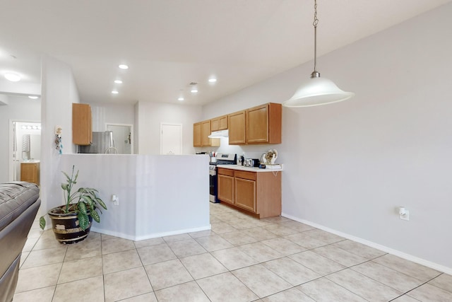 kitchen with pendant lighting, stainless steel appliances, and light tile patterned floors