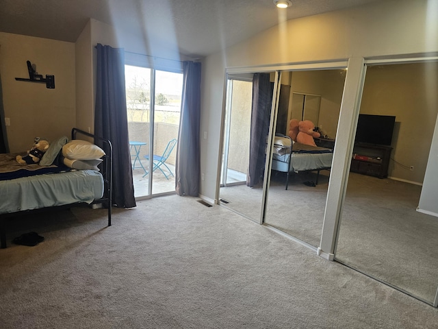 bedroom with access to outside, carpet, and lofted ceiling