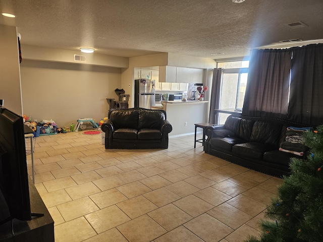 living room with a textured ceiling