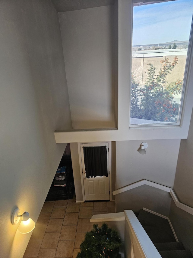 interior space featuring tile patterned flooring and a healthy amount of sunlight