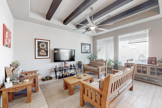 living room featuring ceiling fan and beam ceiling