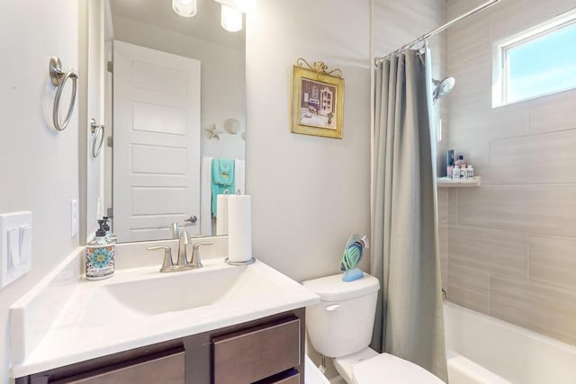 full bathroom with shower / tub combo with curtain, vanity, and toilet