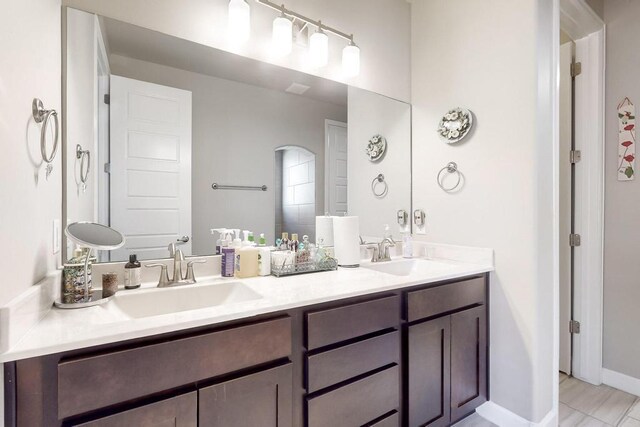 bathroom featuring tile patterned floors and vanity