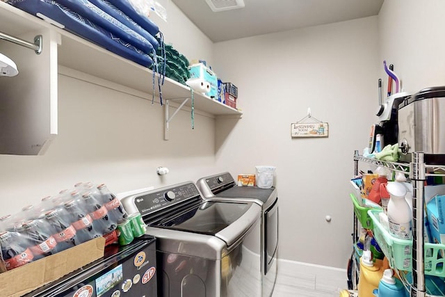 laundry area with washing machine and dryer