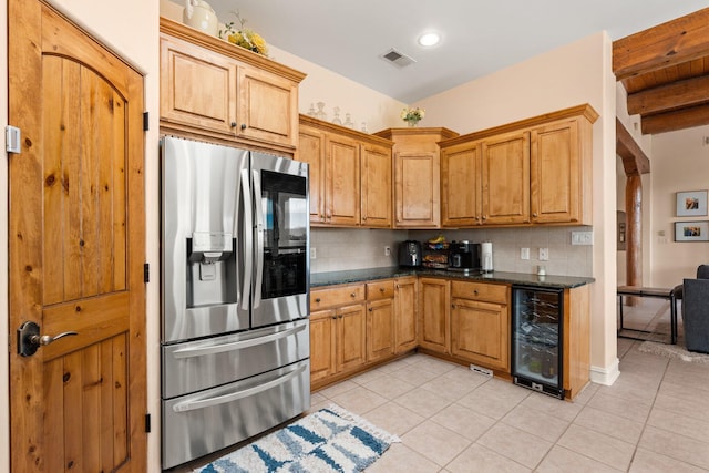 kitchen with beverage cooler, light tile patterned floors, visible vents, and stainless steel fridge with ice dispenser