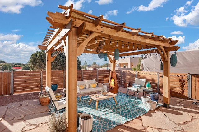 view of patio / terrace featuring outdoor lounge area, a fenced backyard, and a pergola