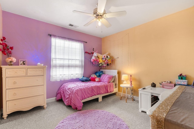 bedroom with baseboards, ceiling fan, visible vents, and light colored carpet