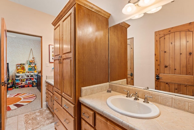 bathroom with tile patterned flooring and vanity