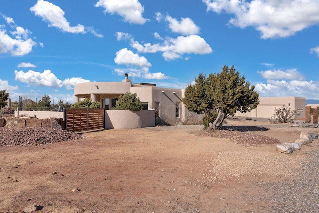 exterior space with fence and stucco siding