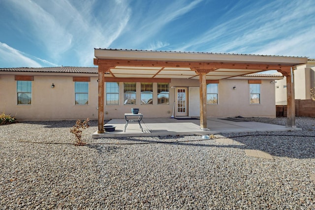 rear view of property with a patio area