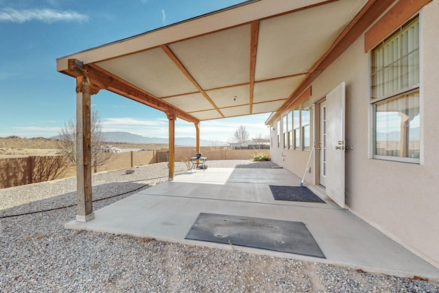 view of patio / terrace with a mountain view