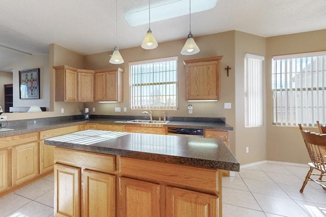 kitchen with a kitchen island, sink, plenty of natural light, and decorative light fixtures