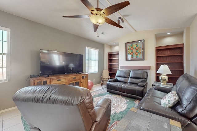 living room featuring vaulted ceiling with beams, light tile patterned floors, and ceiling fan