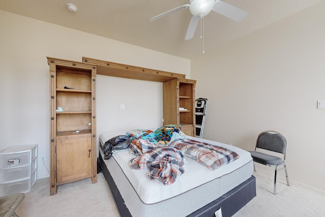 bedroom with light colored carpet and ceiling fan