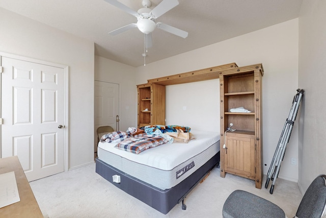 bedroom with ceiling fan and light colored carpet