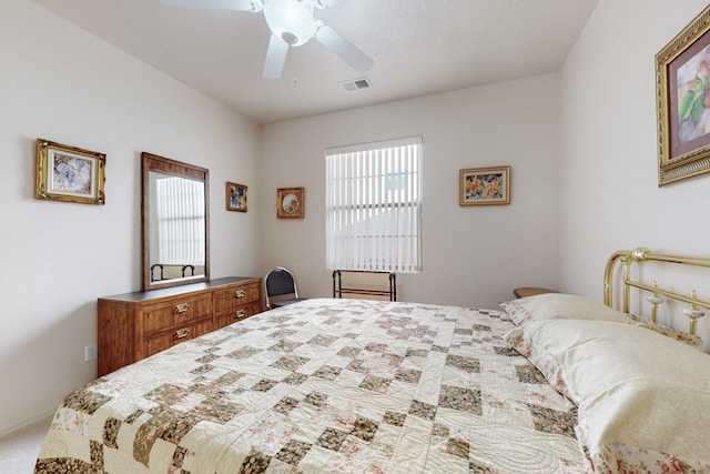 carpeted bedroom featuring multiple windows and ceiling fan