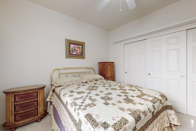 carpeted bedroom with a closet and ceiling fan