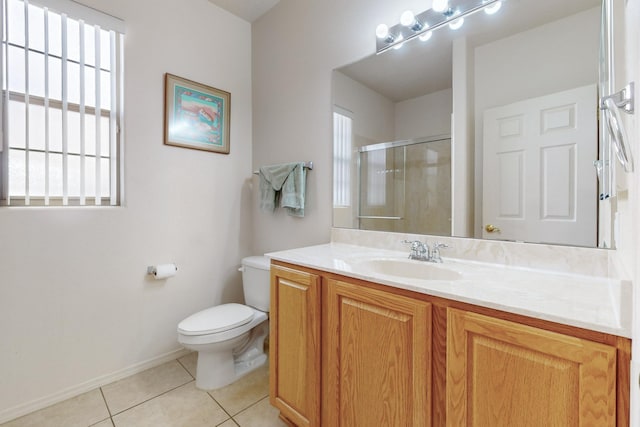 bathroom with vanity, a shower with door, tile patterned floors, and toilet