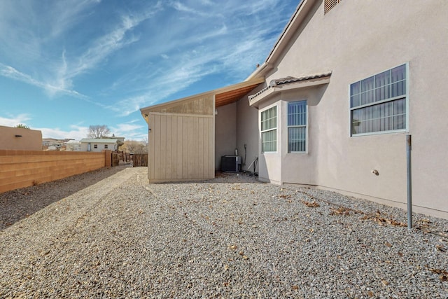 view of side of home featuring central air condition unit