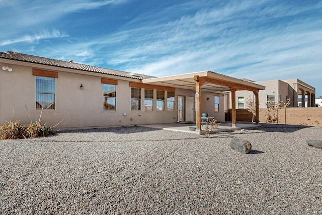 back of house featuring a patio