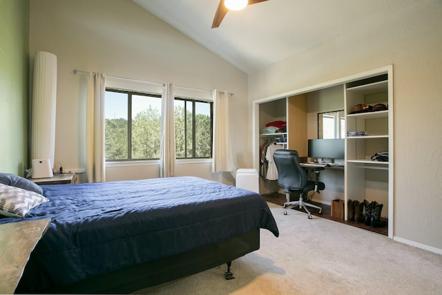 bedroom featuring carpet, a closet, vaulted ceiling, and ceiling fan