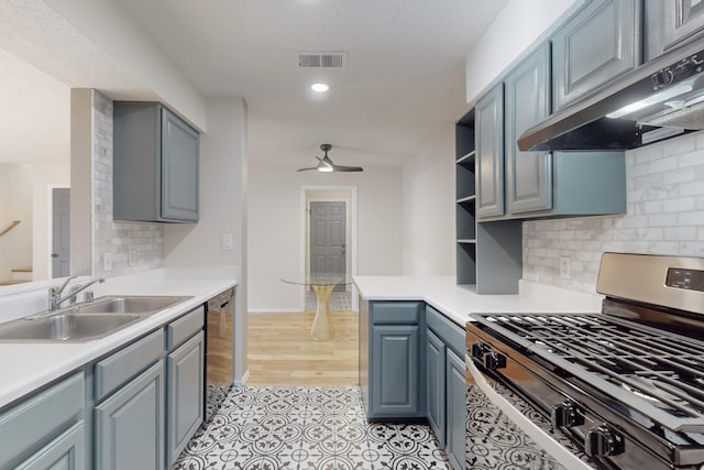 kitchen with sink, ceiling fan, tasteful backsplash, kitchen peninsula, and stainless steel appliances