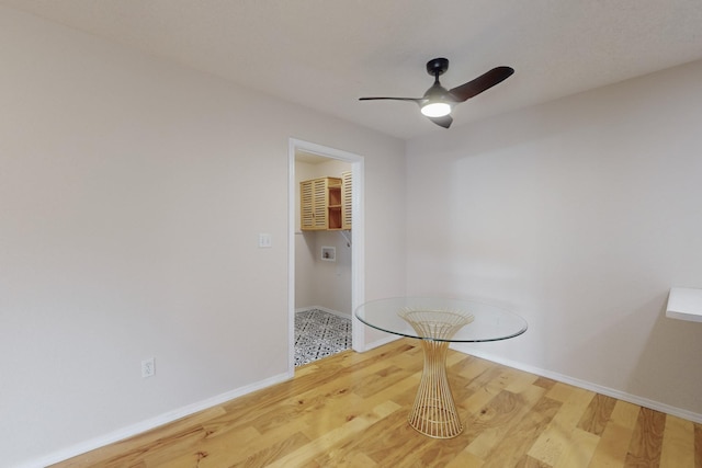 unfurnished dining area with hardwood / wood-style floors and ceiling fan